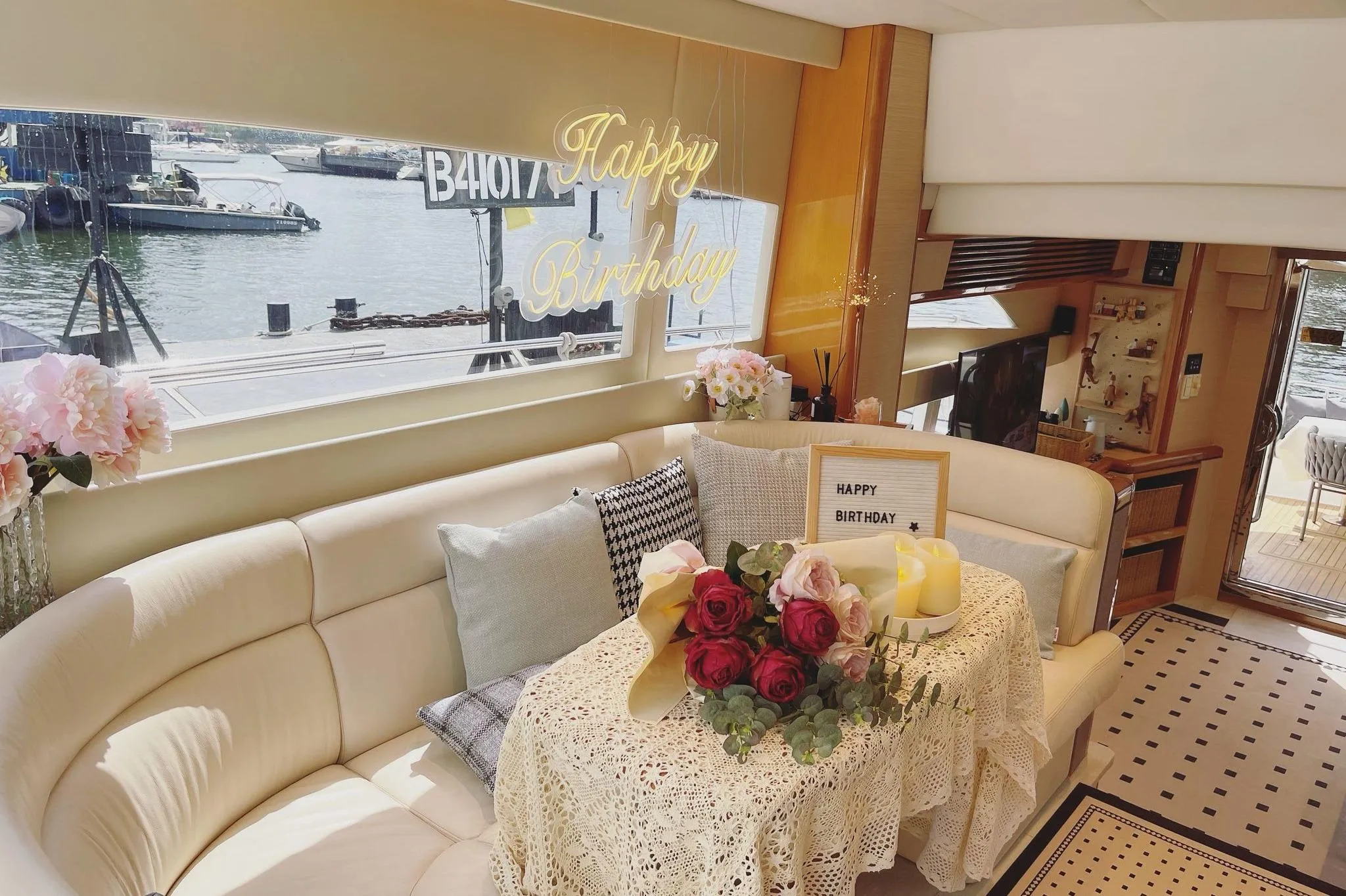 Luxurious yacht interior with birthday decorations, flowers, and candles, Ruby 55 model, 2007.