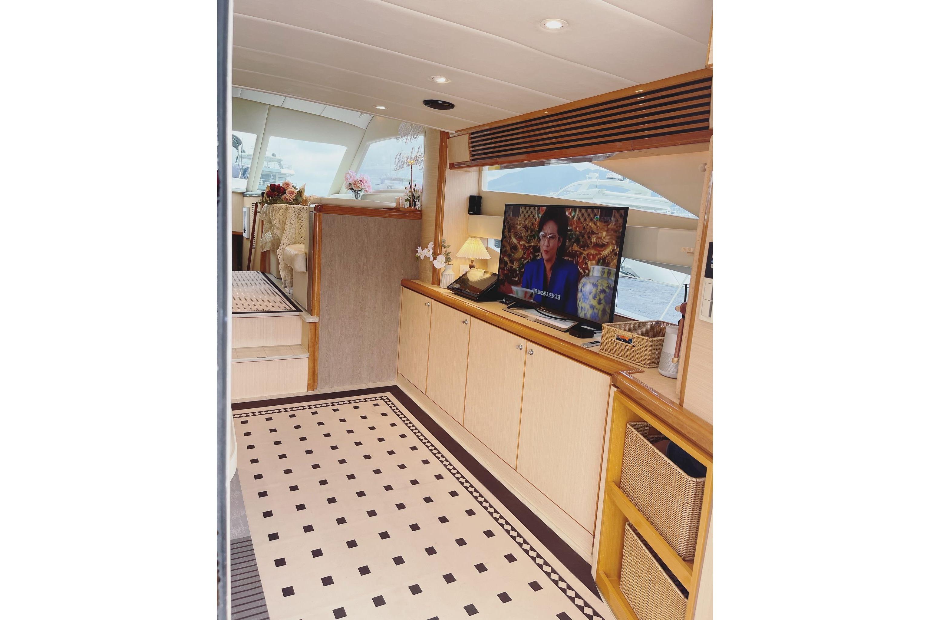 Luxurious interior of 2007 Ruby 55 yacht with modern decor and entertainment system.