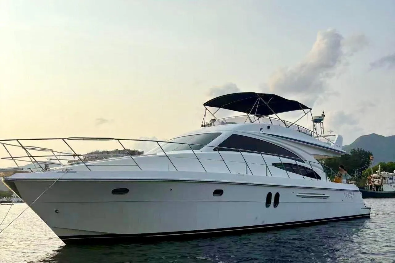 Luxurious 2007 Ruby 55 yacht with sleek design, anchored in serene waters.