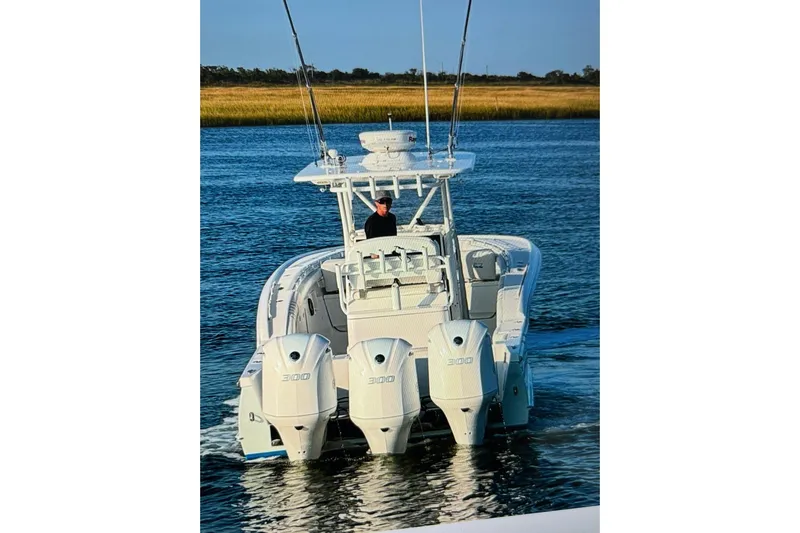  Yacht Photos Pics 2017 Buddy Davis 34 Center Console boat with triple 300 engines on water.