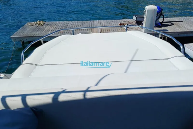  Yacht Photos Pics Fiart 52 yacht (2017) docked at marina, featuring spacious sun deck.