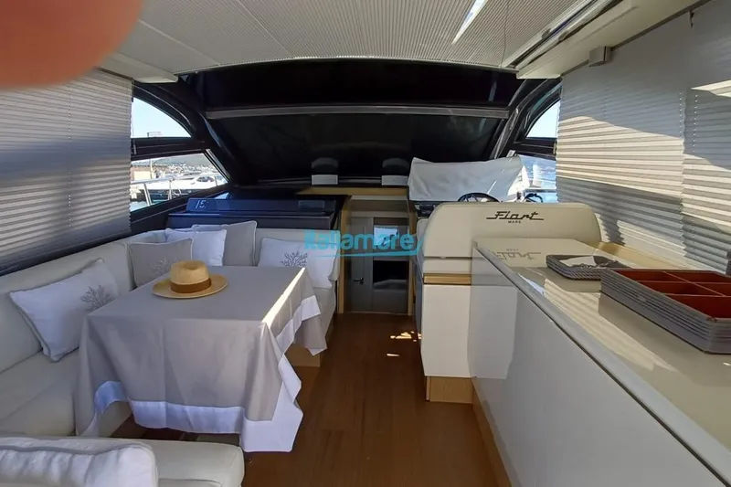  Yacht Photos Pics Luxurious interior of a 2017 Fiart 52 yacht with elegant seating and dining area.