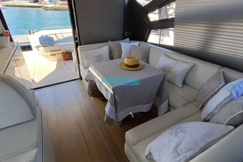  Yacht Photos Pics Luxurious interior of 2017 Fiart 52 yacht with elegant seating and table setting.