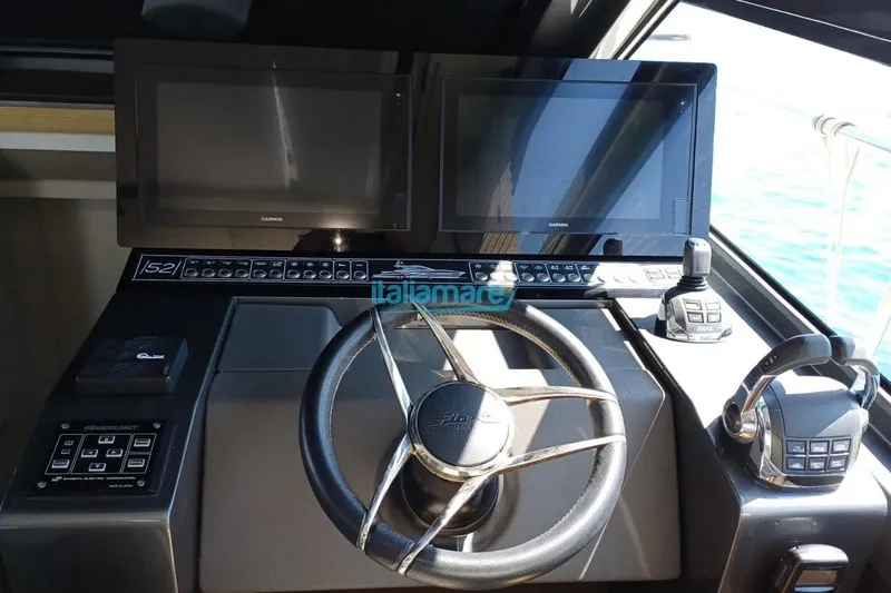  Yacht Photos Pics Cockpit of 2017 Fiart 52 yacht with dual Garmin displays and steering wheel.