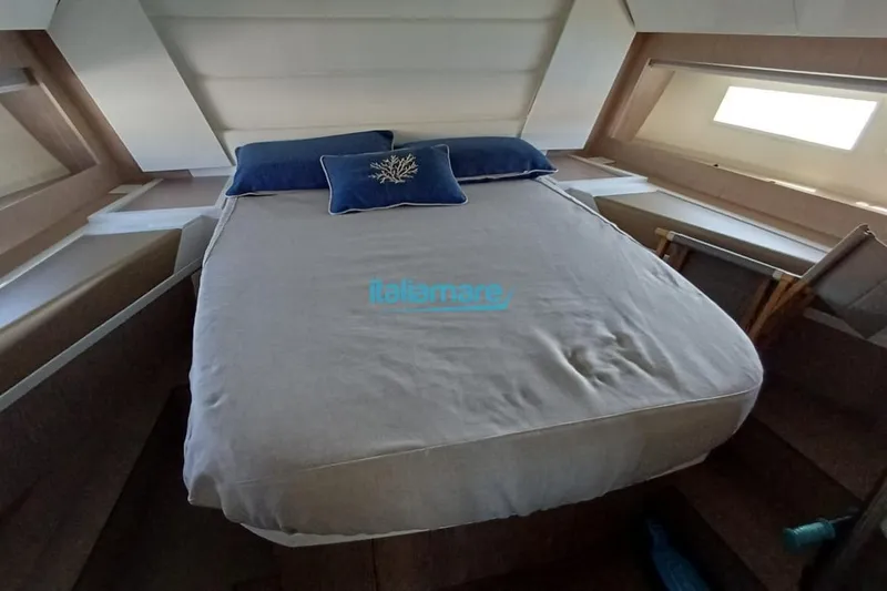  Yacht Photos Pics Luxurious cabin interior of 2017 Fiart 52 yacht with comfortable bedding.