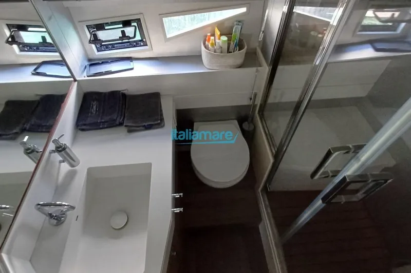  Yacht Photos Pics Modern bathroom interior of 2017 Fiart 52 yacht with sink, toilet, and shower.