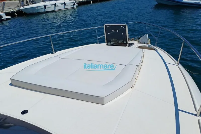  Yacht Photos Pics 2017 Fiart 52 yacht bow with sunbed, docked in a marina.