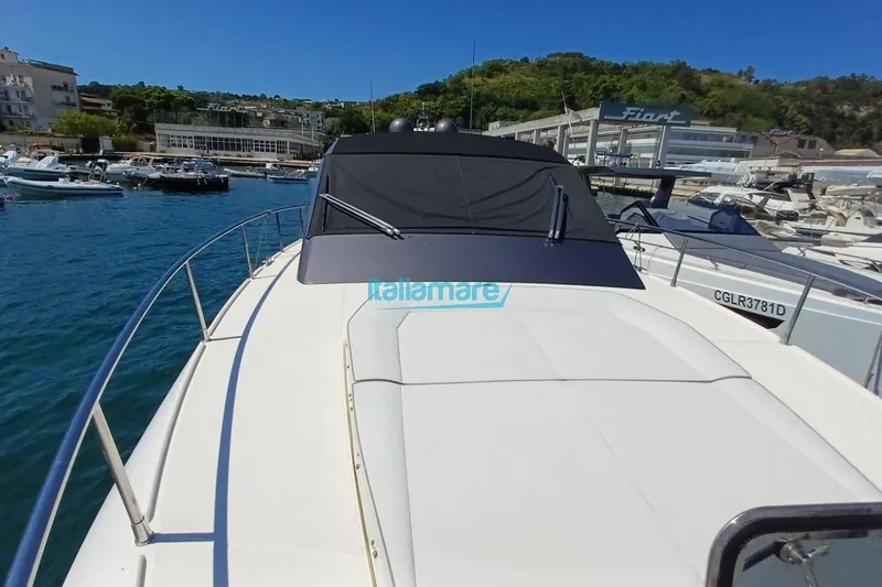  Yacht Photos Pics 2017 Fiart 52 yacht docked at marina, surrounded by water and boats.