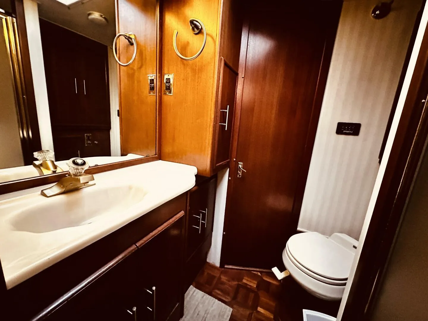 1985 Post 43 Sport Fisherman bathroom with wood accents and modern fixtures.