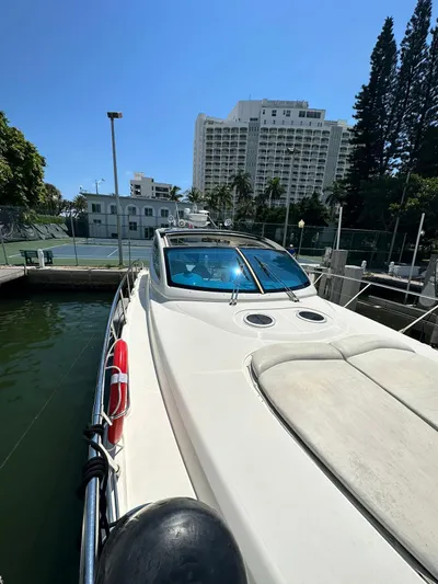 Zuri Yacht Photos Pics 2007 Cranchi Mediterranee 50 HT docked in a marina with buildings in the background.