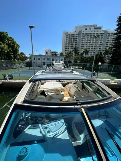 Zuri Yacht Photos Pics 2007 Cranchi Mediterranee 50 HT yacht docked at marina with cityscape background.