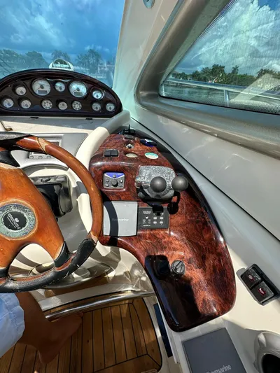Zuri Yacht Photos Pics 2007 Cranchi Mediterranee 50 HT helm with wooden dashboard and steering wheel.