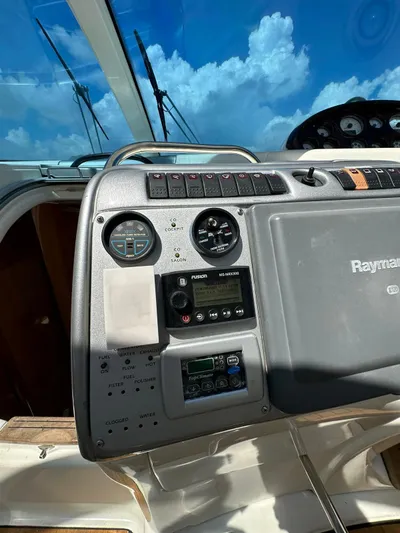 Zuri Yacht Photos Pics Control panel of a 2007 Cranchi Mediterranee 50 HT yacht under a clear blue sky.