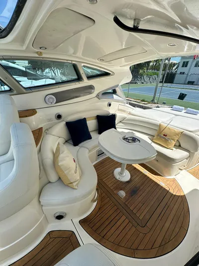 Zuri Yacht Photos Pics Luxurious 2007 Cranchi Mediterranee 50 HT yacht interior with plush seating and wooden flooring.