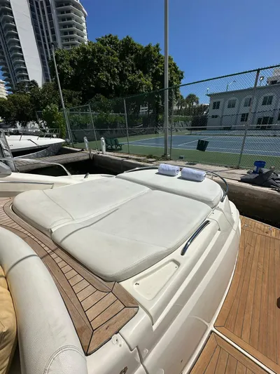 Zuri Yacht Photos Pics 2007 Cranchi Mediterranee 50 HT yacht with sunbathing area, docked near tennis courts.