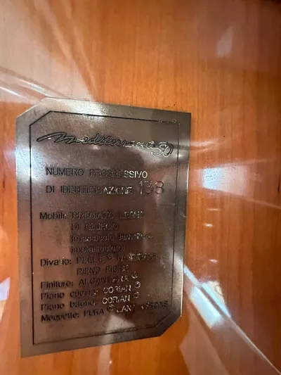 Zuri Yacht Photos Pics Cranchi Mediterranee 50 HT 2007 identification plaque on wooden interior.