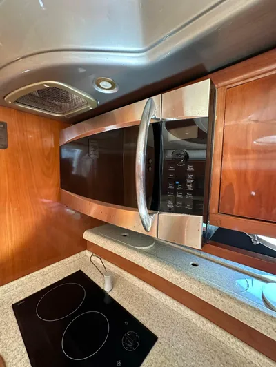 Zuri Yacht Photos Pics 2007 Cranchi Mediterranee 50 HT kitchen with microwave and stovetop.