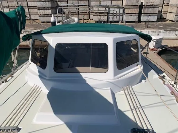  Yacht Photos Pics 1988 Ocean Custom boat with green canopy docked at marina.