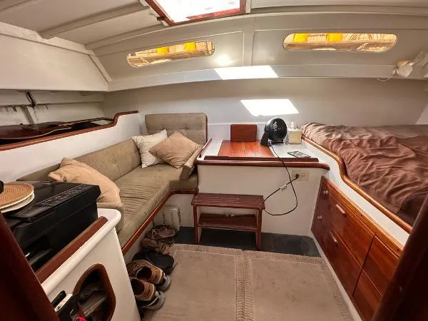  Yacht Photos Pics Cozy 1988 Ocean Custom boat interior with seating, bed, and wooden accents.