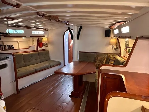  Yacht Photos Pics Cozy 1988 Ocean Custom boat interior with wooden furnishings and cushioned seating.