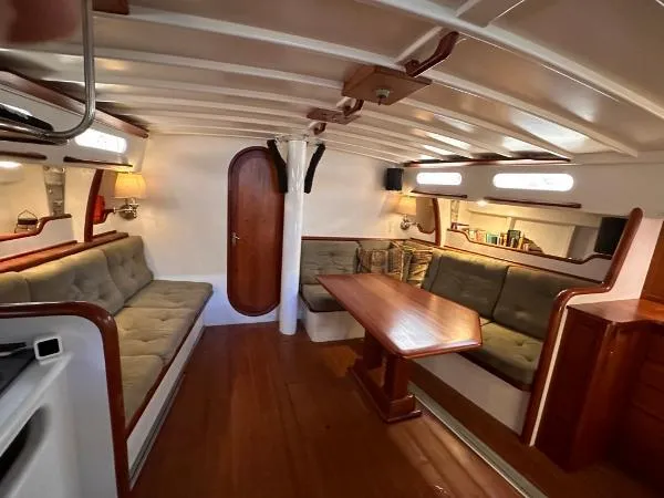  Yacht Photos Pics Spacious 1988 Ocean Custom yacht interior with wooden furnishings and cozy seating area.