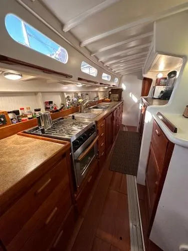  Yacht Photos Pics Spacious 1988 Ocean Custom yacht kitchen with wooden cabinetry and modern appliances.