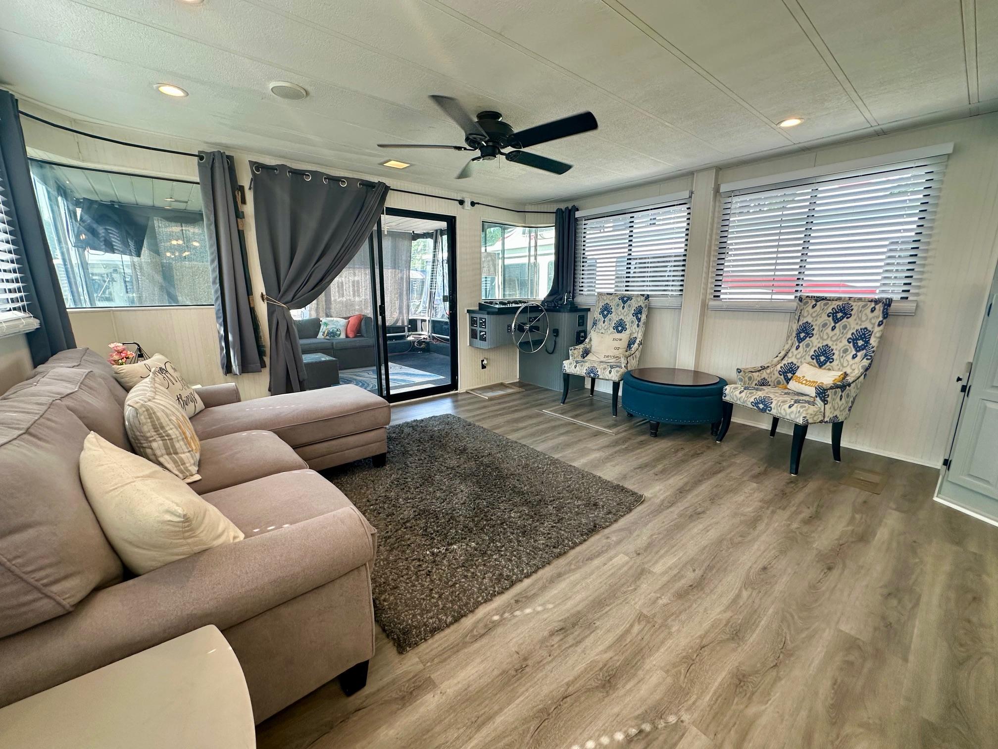 Spacious Lakeview 15x70 houseboat interior with modern decor, featuring a cozy seating area.
