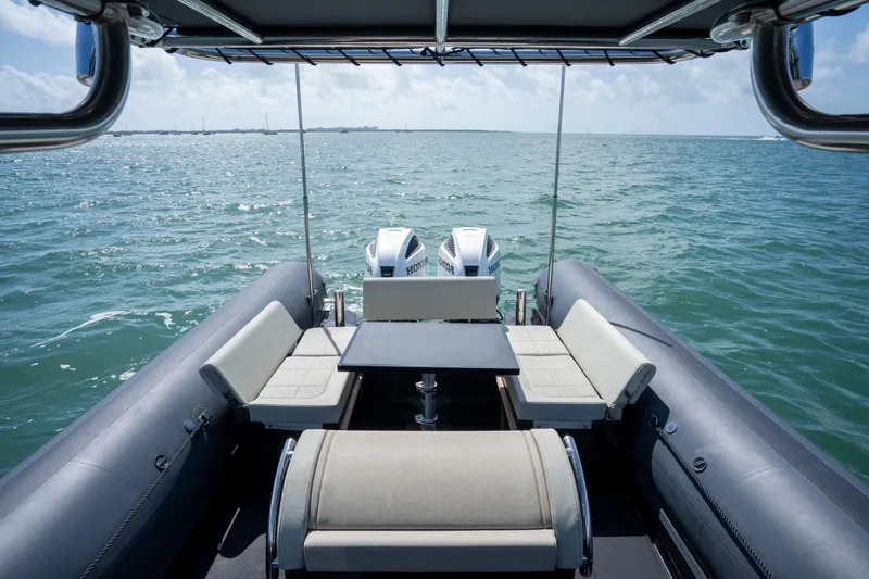  Yacht Photos Pics 2023 Sea Water PHANTOM 280 boat interior with seating, table, and ocean view.