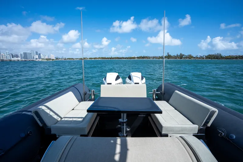  Yacht Photos Pics 2023 Sea Water PHANTOM 280 boat interior with seating, table, and ocean view.