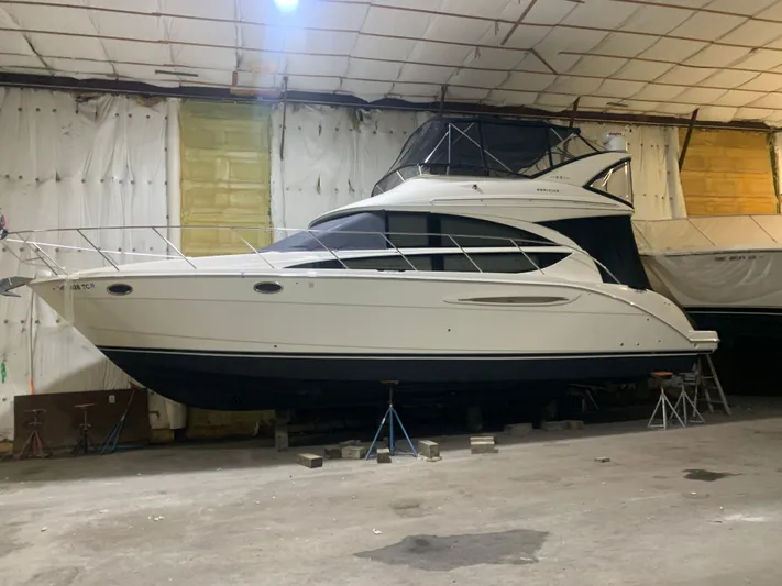 Continuous Wave Yacht Photos Pics 2007 Meridian 391 yacht in storage, showcasing sleek design and elevated flybridge.