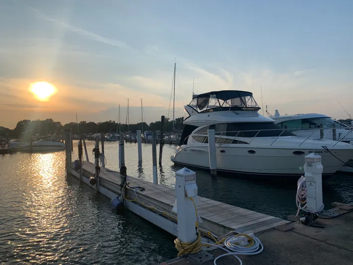 Continuous Wave Yacht Photos Pics 2007 Meridian 391 yacht docked at sunset in a serene marina setting.