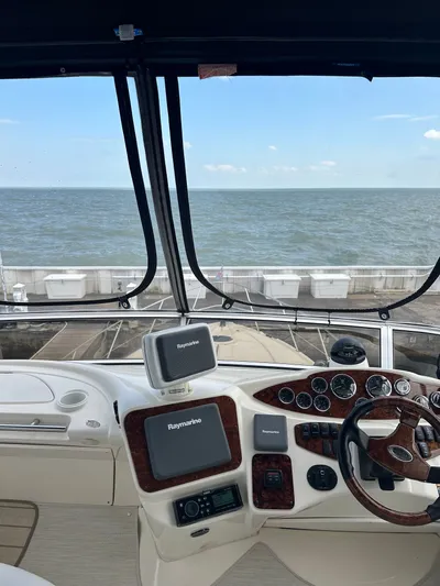 Continuous Wave Yacht Photos Pics Helm of 2007 Meridian 391 yacht with Raymarine navigation, overlooking the ocean.