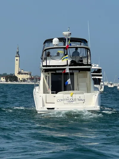 Continuous Wave Yacht Photos Pics 2007 Meridian 391 yacht "Continuous Wave" cruising near a coastal tower.