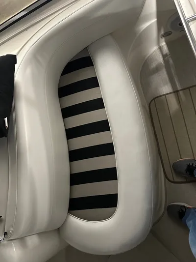 Continuous Wave Yacht Photos Pics White leather seating on a 2007 Meridian 391 boat, featuring striped cushion design.