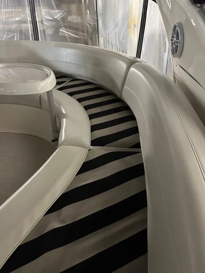 Continuous Wave Yacht Photos Pics Interior seating of 2007 Meridian 391 yacht with striped cushions and round table.