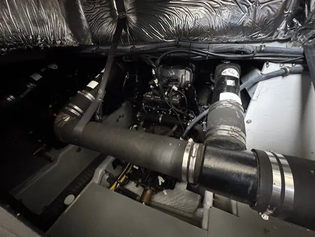 Continuous Wave Yacht Photos Pics Engine compartment of a 2007 Meridian 391 boat, showcasing mechanical components and piping.