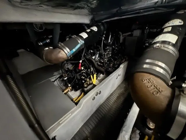 Continuous Wave Yacht Photos Pics Engine compartment of a 2007 Meridian 391 yacht, showcasing mechanical components and piping.