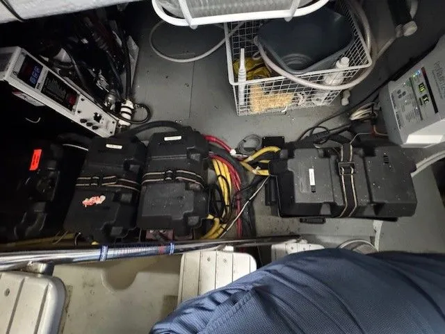 Continuous Wave Yacht Photos Pics Battery compartment of a 2007 Meridian 391 boat with cables and storage baskets.