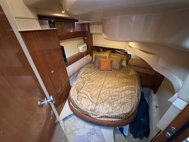 Continuous Wave Yacht Photos Pics Luxurious cabin interior of 2007 Meridian 391 yacht with cozy bed and elegant wood finishes.