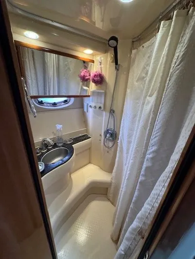 Continuous Wave Yacht Photos Pics 2007 Meridian 391 yacht bathroom with shower, sink, and mirror.