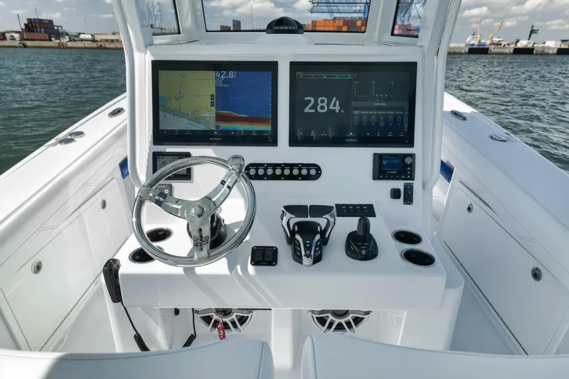 36 Offshore Yacht Photos Pics 2025 Yellowfin 36 Offshore boat cockpit with advanced navigation displays and controls.