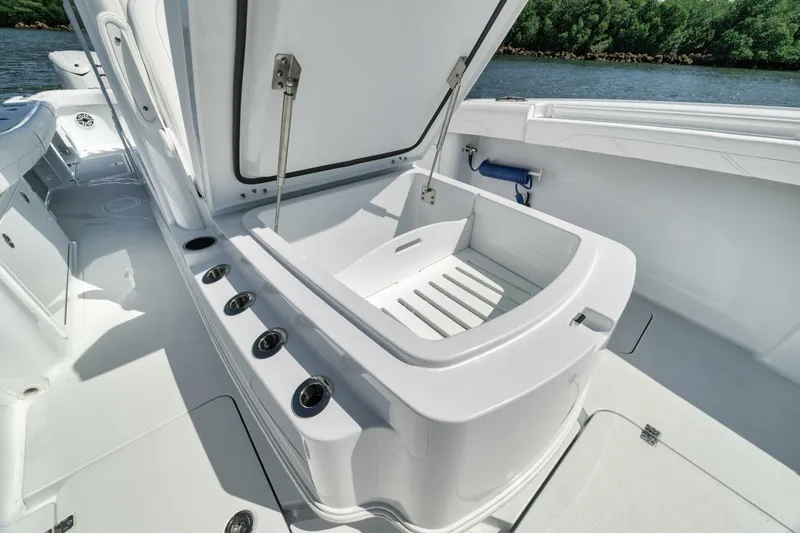 36 Offshore Yacht Photos Pics 2025 Yellowfin 36 Offshore boat with open storage compartment on deck.