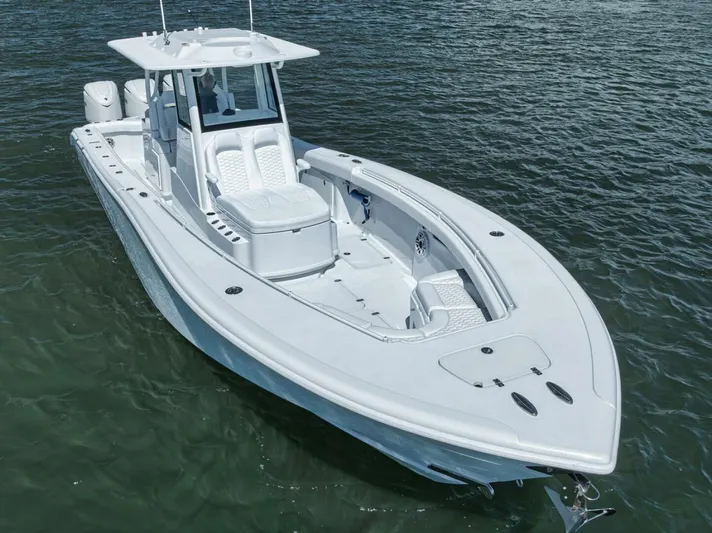 36 Offshore Yacht Photos Pics 2025 Yellowfin 36 Offshore boat on water, showcasing sleek design and spacious deck.