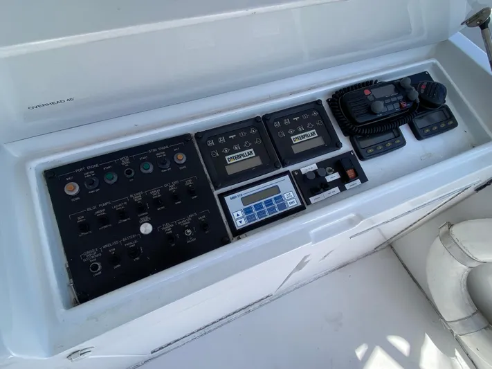 Rock Mama Yacht Photos Pics Control panel of a 2001 Hatteras 55 Convertible yacht with various instruments.