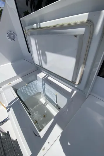 Rock Mama Yacht Photos Pics Open storage compartment on a 2001 Hatteras 55 Convertible boat.