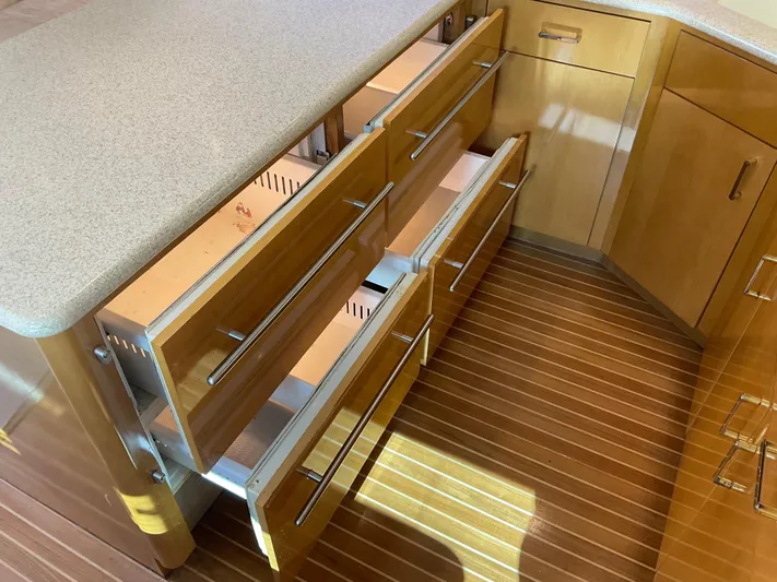 Rock Mama Yacht Photos Pics Kitchen drawers and cabinets in a 2001 Hatteras 55 Convertible yacht.