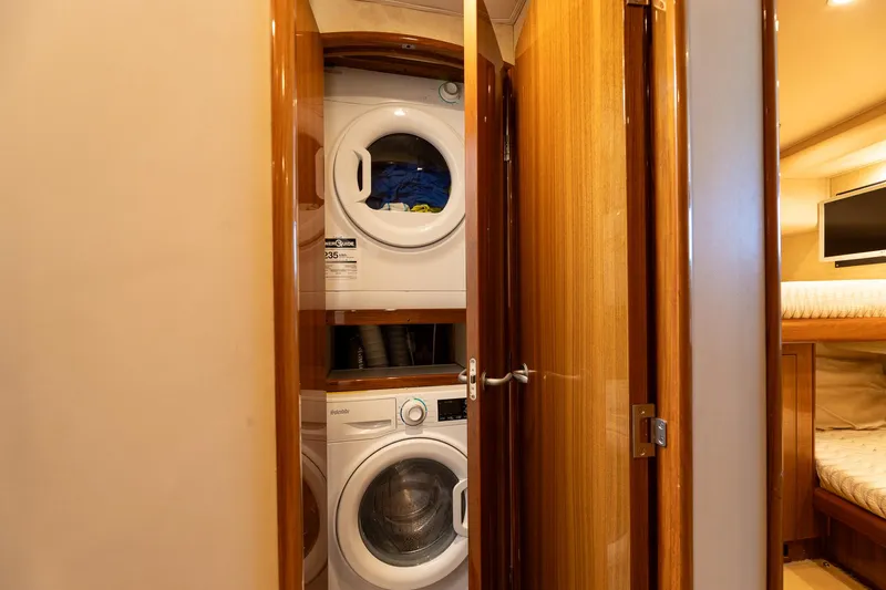 Miss Ella Maye Yacht Photos Pics Stacked washer and dryer in 2008 Viking 54 Sport Fisher yacht.