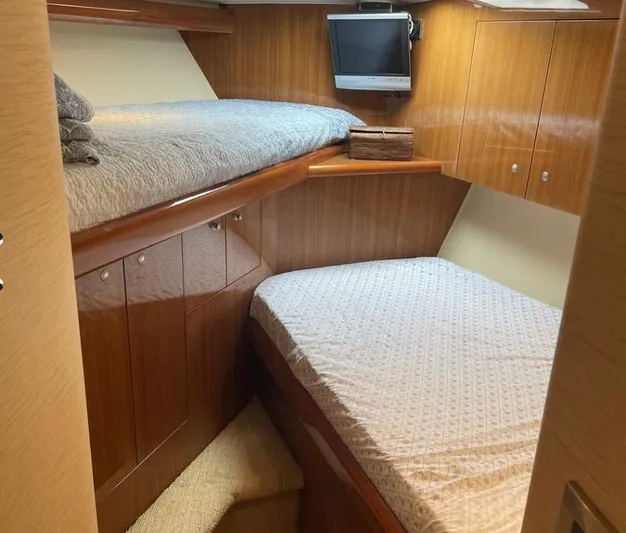 Miss Ella Maye Yacht Photos Pics 2008 Viking 54 Sport Fisher cabin with twin beds and TV.