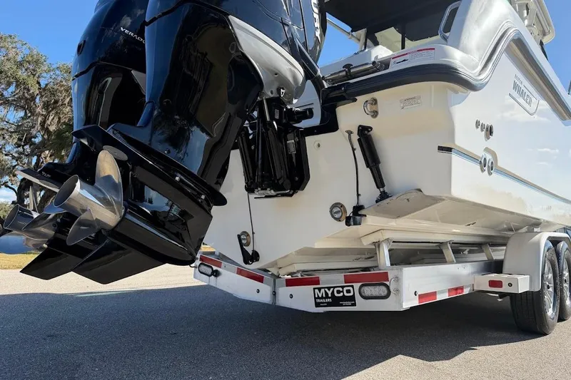  Yacht Photos Pics 2017 Boston Whaler 285 Conquest on trailer, featuring dual outboard engines.