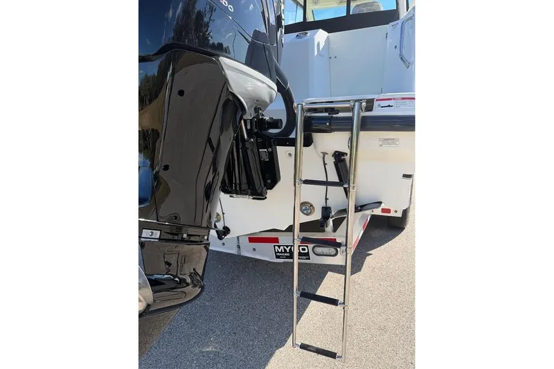  Yacht Photos Pics 2017 Boston Whaler 285 Conquest boat with ladder and motor detail.